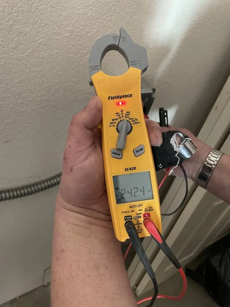 Voltage testing with clamp meter during Electrical Installation Services in Oak Lawn